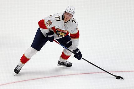 Nov 17, 2023; Anaheim, California, USA; Florida Panthers defenseman Niko Mikkola (77) shoots during the second period against the Anaheim Ducks at Honda Center. Mandatory Credit: Jason Parkhurst-USA TODAY Sports