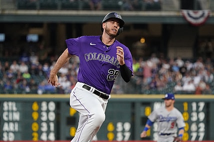 Apr 3, 2021; Denver, Colorado, USA;  Colorado Rockies first baseman C.J. Cron (25) heads in to score a run against the Los Angeles Dodgers in the fourth inning at Coors Field. Mandatory Credit: Ron Chenoy-USA TODAY Sports