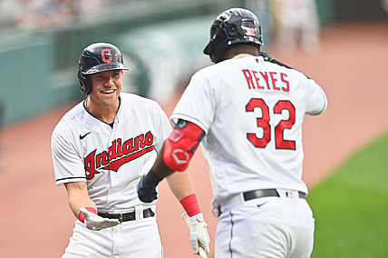 Apr 9, 2021; Cleveland, Ohio, USA; Cleveland Indians first baseman Jake Bauers (10) celebrates with designated hitter Franmil Reyes (32) after Reyes hit a home run during the first inning against the Detroit Tigers at Progressive Field. Mandatory Credit: Ken Blaze-USA TODAY Sports