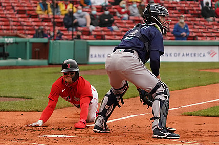 Apr 25, 2021; Boston, Massachusetts, USA; Boston Red Sox second baseman Enrique Hernandez (5) scores against the Seattle Mariners in the first inning at Fenway Park. Mandatory Credit: David Butler II-USA TODAY Sports