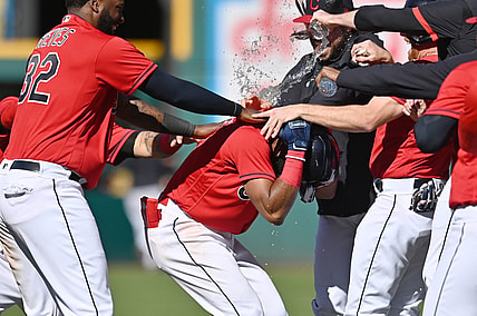 May 12, 2021; Cleveland, Ohio, USA; Cleveland Indians center fielder Amed Rosario (1) celebrates with designated hitter Franmil Reyes (32) and teammates after hitting a game winning single during the tenth inning against the Chicago Cubs at Progressive Field. Mandatory Credit: Ken Blaze-USA TODAY Sports