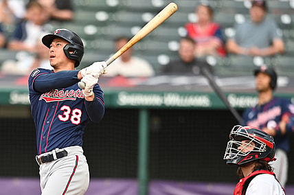 May 21, 2021; Cleveland, Ohio, USA; Minnesota Twins center fielder Rob Refsnyder (38) and Cleveland Indians catcher Austin Hedges (17) watch as Refsnyder hits a home run during the third inning at Progressive Field. Mandatory Credit: Ken Blaze-USA TODAY Sports