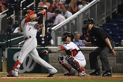 May 25, 2021; Washington, District of Columbia, USA; Cincinnati Reds third baseman Eugenio Suarez (7) hits a solo home run against the Washington Nationals during the sixth inning at Nationals Park. Mandatory Credit: Brad Mills-USA TODAY Sports