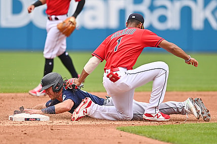 Jun 13, 2021; Cleveland, Ohio, USA; Seattle Mariners second baseman Dylan Moore (25) is caught stealing by Cleveland Indians shortstop Amed Rosario (1) during the third inning at Progressive Field. Mandatory Credit: Ken Blaze-USA TODAY Sports
