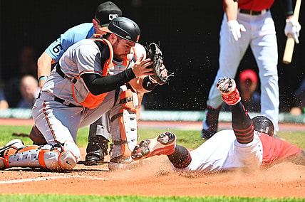Jun 17, 2021; Cleveland, Ohio, USA; Cleveland Indians third baseman Yu Chang (2) scores as Baltimore Orioles catcher Austin Wynns (61) is late with the tag during the fourth inning at Progressive Field. Mandatory Credit: Ken Blaze-USA TODAY Sports