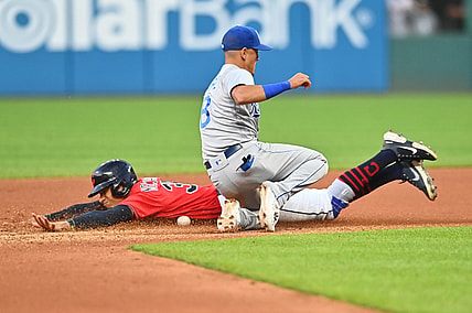 Jul 9, 2021; Cleveland, Ohio, USA; Cleveland Indians left fielder Oscar Mercado (35) slides into second base on a stolen base as Kansas City Royals shortstop Nicky Lopez (8) can not handle the throw during the seventh inning at Progressive Field. Mandatory Credit: Ken Blaze-USA TODAY Sports