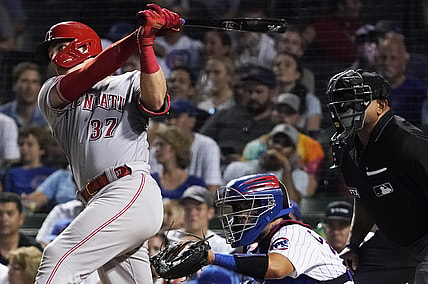 Jul 28, 2021; Chicago, Illinois, USA; Cincinnati Reds catcher Tyler Stephenson (37) hits a two run single against the Chicago Cubs during the fifth inning at Wrigley Field. Mandatory Credit: David Banks-USA TODAY Sports