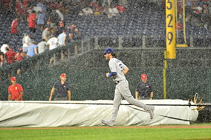 Aug 10, 2021; Philadelphia, Pennsylvania, USA; Los Angeles Dodgers center fielder Cody Bellinger (35) runs off the field during rain delay in the fourth inning against the Philadelphia Phillies at Citizens Bank Park. Mandatory Credit: Eric Hartline-USA TODAY Sports