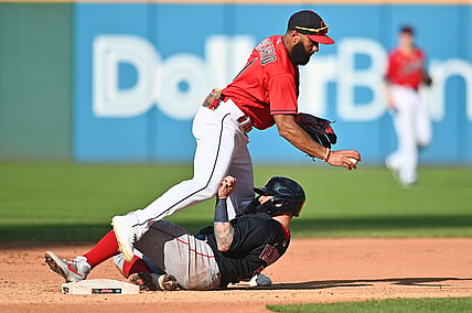 Aug 28, 2021; Cleveland, Ohio, USA; Cleveland Indians shortstop Amed Rosario (1) forces out Boston Red Sox catcher Christian Vazquez (7) during the fifth inning at Progressive Field. Mandatory Credit: Ken Blaze-USA TODAY Sports