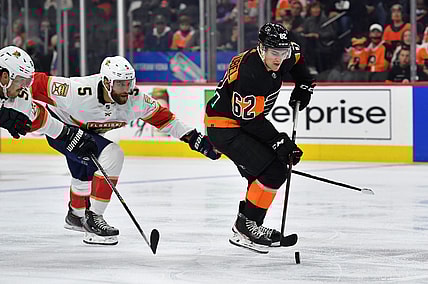Oct 23, 2021; Philadelphia, Pennsylvania, USA; Philadelphia Flyers right wing Nicolas Aube-Kubel (62) carries the puck against Florida Panthers defenseman Aaron Ekblad (5) during the third period at Wells Fargo Center. Mandatory Credit: Eric Hartline-USA TODAY Sports