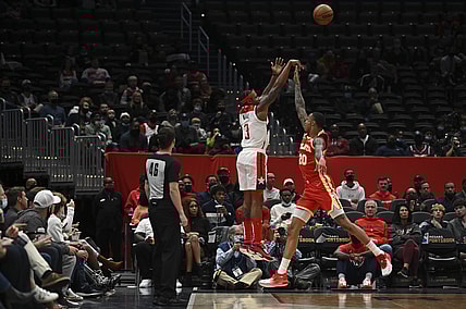 Oct 28, 2021; Washington, District of Columbia, USA;  Washington Wizards guard Bradley Beal (3) shoots over Atlanta Hawks forward John Collins (20) during the first half at Capital One Arena. Mandatory Credit: Tommy Gilligan-USA TODAY Sports