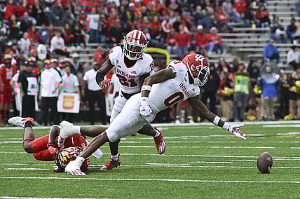 Oct 30, 2021; College Park, Maryland, USA;  Indiana Hoosiers quarterback Donaven McCulley (0) reaches for a tipped ball during the first half against the Maryland Terrapins at Capital One Field at Maryland Stadium. Mandatory Credit: Tommy Gilligan-USA TODAY Sports