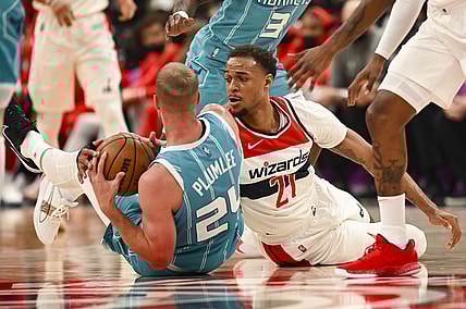 Nov 22, 2021; Washington, District of Columbia, USA;  Charlotte Hornets center Mason Plumlee (24) and Washington Wizards center Daniel Gafford (21) battle for a loose ball during the first half at Capital One Arena. Mandatory Credit: Tommy Gilligan-USA TODAY Sports