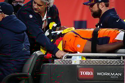 Dec 19, 2021; Denver, Colorado, USA; Denver Broncos quarterback Teddy Bridgewater (5) is carted off the field in the third quarter against the Cincinnati Bengals at Empower Field at Mile High Mandatory Credit: Ron Chenoy-USA TODAY Sports