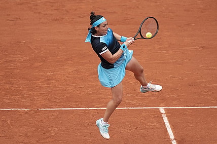 May 22, 2022; Paris, France;  Ons Jabeur (TUN) returns the ball during her match against Magda Linette (POL) on day one of the French Open at Stade Roland-Garros. Mandatory Credit: Susan Mullane-USA TODAY Sports