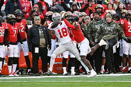 Nov 19, 2022; College Park, Maryland, USA;  Ohio State Buckeyes wide receiver Marvin Harrison Jr. (18) catches a pass as Maryland Terrapins defensive back Deonte Banks (3) defends during the first quarter at SECU Stadium. Mandatory Credit: Tommy Gilligan-USA TODAY Sports
