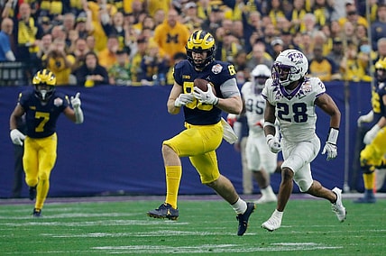 Michigan tight end Luke Schoonmaker (86) runs after a reception while TCU safety Millard Bradford (28) chases during the first quarter of the Fiesta Bowl on Saturday, Dec. 31 at State Farm Stadium in Glendale, Ariz.

2022-12-31-michigan-fiesta