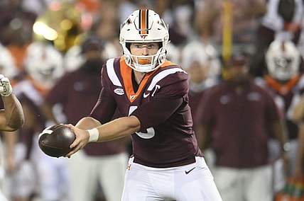 Sep 2, 2023; Blacksburg, Virginia, USA;  Virginia Tech Hokies quarterback Grant Wells (6)  hands off ball in the second quarter against the Old Dominion Monarchs at Lane Stadium. Mandatory Credit: Lee Luther Jr.-USA TODAY Sports