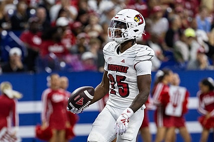 Sep 16, 2023; Indianapolis, Indiana, USA; Louisville Cardinals running back Jawhar Jordan (25) celebrates after scoring a touchdown against the Indiana Hoosiers in the second quarter at Lucas Oil Stadium. Mandatory Credit: Trevor Ruszkowski-USA TODAY Sports