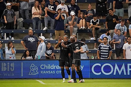 Sep 20, 2023; Kansas City, Kansas, USA; Nashville SC midfielder Hany Mukhtar (10) celebrates his goal scored against Sporting Kansas City with midfielder Dax McCarty (6) and midfielder Fafa Picault (7) during the second half at Children's Mercy Park. Mandatory Credit: Denny Medley-USA TODAY Sports