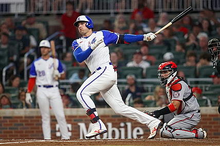 Sep 30, 2023; Atlanta, Georgia, USA; Atlanta Braves third baseman Austin Riley (27) hits a double against the Washington Nationals in the first inning at Truist Park. Mandatory Credit: Brett Davis-USA TODAY Sports