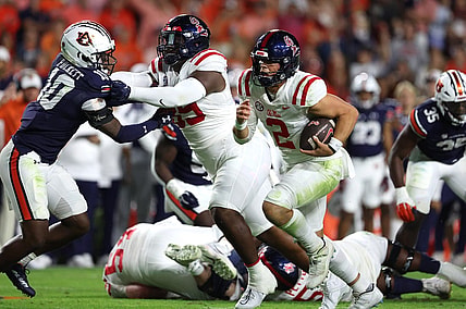 Oct 21, 2023; Auburn, Alabama, USA;  Mississippi Rebels quarterback Jaxson Dart (2) carries against the Auburn Tigers during the first quarter at Jordan-Hare Stadium. Mandatory Credit: John Reed-USA TODAY Sports
