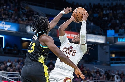 Nov 3, 2023; Indianapolis, Indiana, USA; Cleveland Cavaliers guard Darius Garland (10) shoots while Indiana Pacers forward Aaron Nesmith (23) defends in the second half at Gainbridge Fieldhouse. Mandatory Credit: Trevor Ruszkowski-USA TODAY Sports