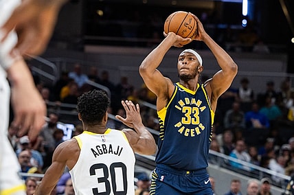 Nov 8, 2023; Indianapolis, Indiana, USA; Indiana Pacers center Myles Turner (33) shoots the ball while Utah Jazz guard Ochai Agbaji (30) defends in the second half at Gainbridge Fieldhouse. Mandatory Credit: Trevor Ruszkowski-USA TODAY Sports