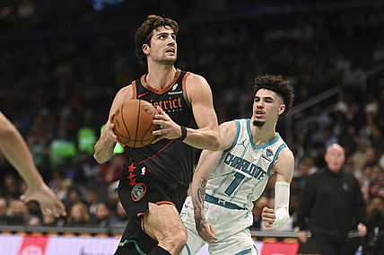 Nov 10, 2023; Washington, District of Columbia, USA;  Washington Wizards forward Deni Avdija (8) makes aa move to the basket y Charlotte Hornets guard LaMelo Ball (1) during the first half at Capital One Arena. Mandatory Credit: Tommy Gilligan-USA TODAY Sports