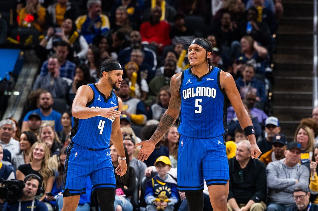 Nov 19, 2023; Indianapolis, Indiana, USA; Orlando Magic forward Paolo Banchero (5)  celebrates his made slam dunk with  guard Jalen Suggs (4) in the first half against the Indiana Pacers at Gainbridge Fieldhouse. Mandatory Credit: Trevor Ruszkowski-USA TODAY Sports