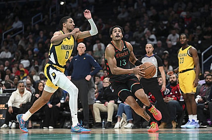 Dec 15, 2023; Washington, District of Columbia, USA;Washington Wizards guard Jordan Poole (13) makes a move to the basket by Indiana Pacers guard Tyrese Haliburton (0) during the first half   at Capital One Arena. Mandatory Credit: Tommy Gilligan-USA TODAY Sports