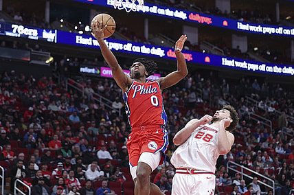Dec 29, 2023; Houston, Texas, USA; Philadelphia 76ers guard Tyrese Maxey (0) shoots the ball as Houston Rockets center Alperen Sengun (28) defends during the third quarter at Toyota Center. Mandatory Credit: Troy Taormina-USA TODAY Sports