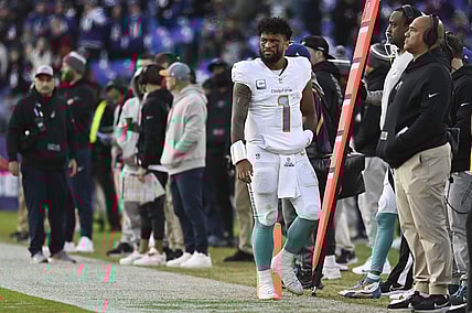 Dec 31, 2023; Baltimore, Maryland, USA;  Miami Dolphins quarterback Tua Tagovailoa (1) walks down the sidelines during the second half against the Baltimore Ravens at M&T Bank Stadium.Baltimore Ravens defeated Miami Dolphins 56-19. Mandatory Credit: Tommy Gilligan-USA TODAY Sports