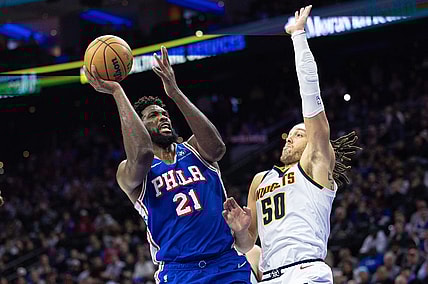 Jan 16, 2024; Philadelphia, Pennsylvania, USA; Philadelphia 76ers center Joel Embiid (21) drives for a shot against Denver Nuggets forward Aaron Gordon (50) during the fourth quarter at Wells Fargo Center. Mandatory Credit: Bill Streicher-USA TODAY Sports