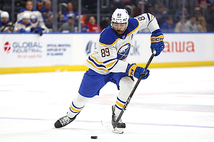 Buffalo Sabres right wing Alex Tuch (89) skates with the puck during the third period of an NHL hockey game against the New York Islanders, Saturday, Nov. 30, 2024, in Elmont, N.Y. (AP Photo/Noah K. Murray)