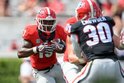 Apr 22, 2017; Athens, GA, USA; Georgia Bulldogs red team running back Elijah Holyfield (13) runs against black team linebacker Tae Crowder (30) during the second half during the Georgia Spring Game at Sanford Stadium. Red defeated Black 25-22. Mandatory Credit: Dale Zanine-USA TODAY Sports