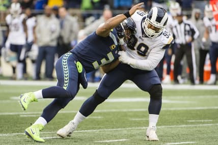 Los Angeles Rams defensive tackle Aaron Donald sacks Settle Seahawks quarterback Russell Wilson