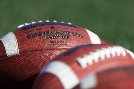 College footballs on field before game