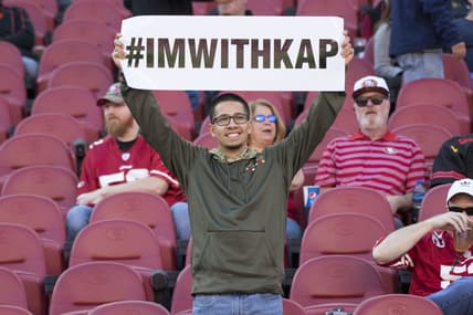 Fans show support for Colin Kaepernick's national anthem protests.