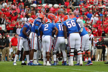 Florida Gators football players huddle