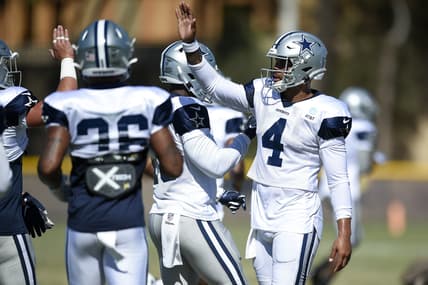 Dallas Cowboys players huddle during training camp