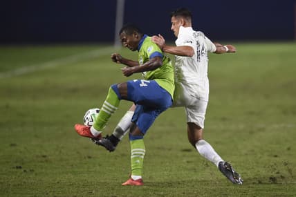 Nov 4, 2020; Carson, California, USA; LA Galaxy forward Javier Hern  ndez (14) battles for the ball with Seattle Sounders FC defender Jimmy Medranda (94) during the second half at Dignity Health Sports Park. Mandatory Credit: Kelvin Kuo-USA TODAY Sports