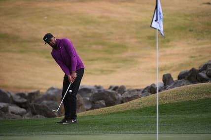 Jan 23, 2021; La Quinta, California, USA; Tony Finau chips onto the 18th green during the third round of The American Express golf tournament at PGA West Peter Dye Stadium Course. Mandatory Credit: Orlando Ramirez-USA TODAY Sports