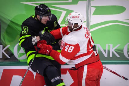 Jan 28, 2021; Dallas, Texas, USA; Detroit Red Wings right wing Givani Smith (48) checks Dallas Stars defenseman John Klingberg (3) during the first period at the American Airlines Center. Mandatory Credit: Jerome Miron-USA TODAY Sports