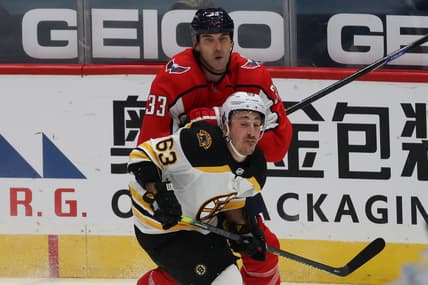 Jan 30, 2021; Washington, District of Columbia, USA; Washington Capitals defenseman Zdeno Chara (33) checks Boston Bruins left wing Brad Marchand (63) in the first period at Capital One Arena. Mandatory Credit: Geoff Burke-USA TODAY Sports