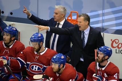 Aug 21, 2020; Toronto, Ontario, CAN; Montreal Canadiens assistant coach Dominique Ducharme (top left) and assistant coach Kirk Muller (top right) direct players during the first period in game six of the first round of the 2020 Stanley Cup Playoffs against the Philadelphia Flyers at Scotiabank Arena. Mandatory Credit: Dan Hamilton-USA TODAY Sports