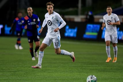 Oct 24, 2020; Cincinnati, OH, USA; Minnesota United FC forward Aaron Schoenfeld (12) plays the field against FC Cincinnati in the second half at Nippert Stadium. Mandatory Credit: Aaron Doster-USA TODAY Sports