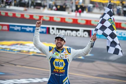 Nov 8, 2020; Avondale, Arizona, USA; NASCAR driver Chase Elliott celebrates with the checkered flag after winning the NASCAR Cup Series Championship at Phoenix Raceway. Mandatory Credit: Mark J. Rebilas-USA TODAY Sports