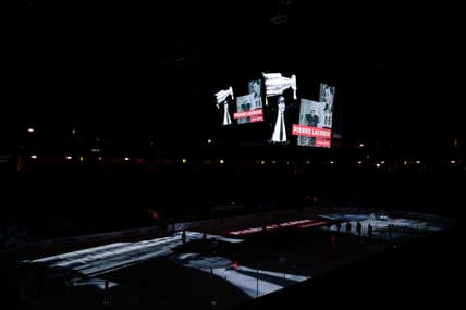 Jan 13, 2021; Denver, Colorado, USA; Former Colorado Avalanche president and general manager Pierre Lacroix is honored on the scoreboard before the game against the St. Louis Blues at Ball Arena. Lacroix died on December 13, 2020 due to complications from COVID-19. Mandatory Credit: Isaiah J. Downing-USA TODAY Sports