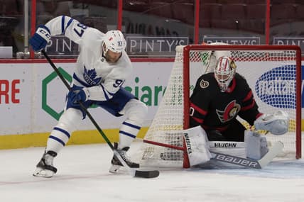 Jan 16, 2021; Ottawa, Ontario, CAN; Toronto Maple Leafs center Joe Thornton (97) moves the puck in front of Ottawa Senators goalie Matt Murray (30) in the first period at the Canadian Tire Centre. Mandatory Credit: Marc DesRosiers-USA TODAY Sports